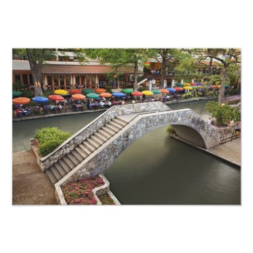 Outdoor cafe along River Walk and bridge over Photo Print