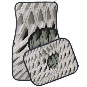 Oval black tint glass panel on white surface car floor mat