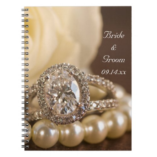 Oval Diamond Ring and White Rose Wedding Notebook