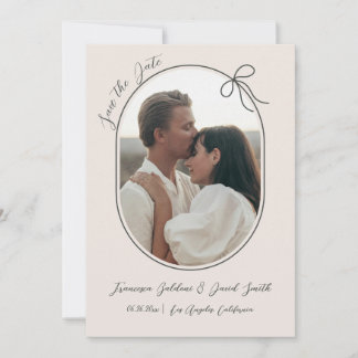 Oval photo with thin border and a minimal bow save the date