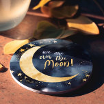Over the Moon Celestial Baby Shower Stars Space Round Paper Coaster<br><div class="desc">Celebrate the arrival of a new little star with these enchanting baby shower paper coasters, featuring a radiant golden moon and shimmering stars on a deep blue space background, all beautifully rendered in watercolors. The header, "We are over the Moon!", adds a touch of joy and excitement to this celestial-themed...</div>
