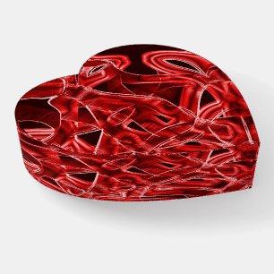 Overlapping and crossed red acrylic cutouts paperweight