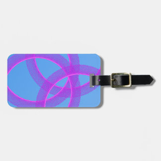 overlapping purple ring in blue background luggage tag