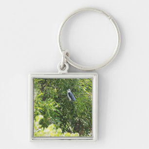 Owl perching on a tree keychain
