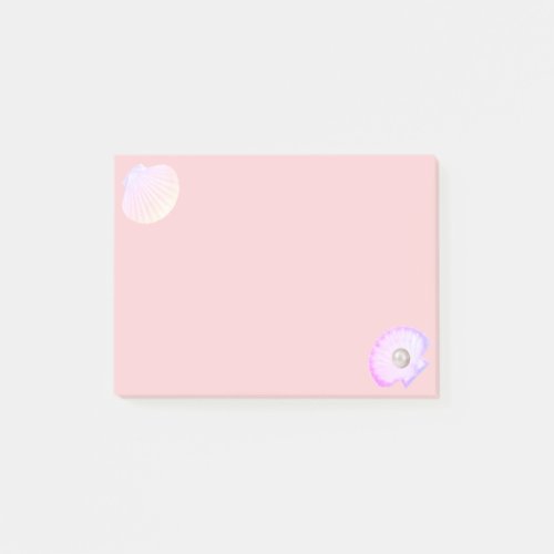 Oyster shell with pearl on light coral pink post_it notes