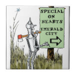 Oz - Tin Man Ceramic Tile<br><div class="desc">This product features one of Denslow's illustrations for the classic children's fantasy tale The Wonderful Wizard of Oz. The Tin Man is looking for a bargain on a heart.</div>
