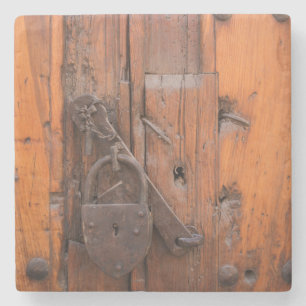 Padlock on wooden door stone coaster