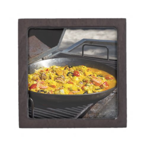 Paella is cooked on a grill gift box