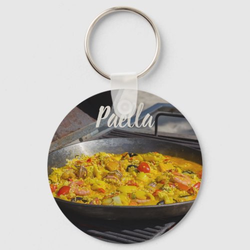 Paella is cooked on a grill gift for chef keychain