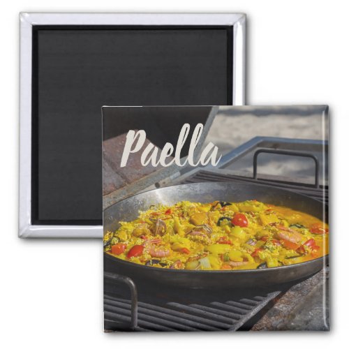 Paella is cooked on a grill gift for chef magnet