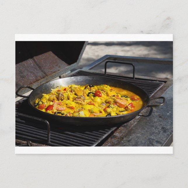 Paella is cooked on a grill postcard (Front)