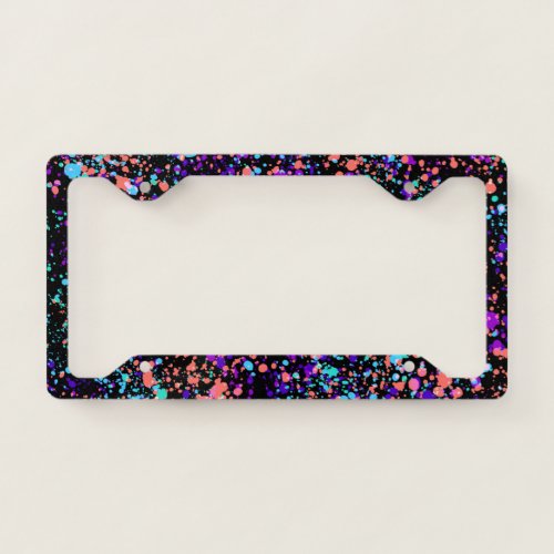paint splashes   green purple coral on black  license plate frame