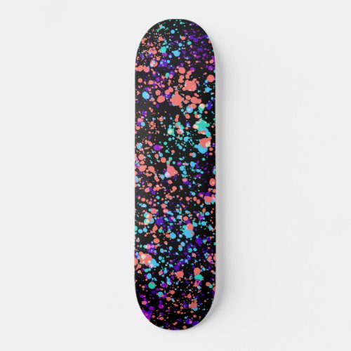 paint splashes   green purple coral on black  skateboard