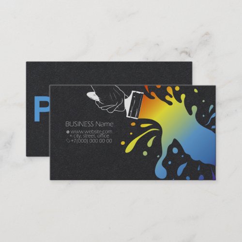 Paintbrush with blots of colored paint in the hand business card