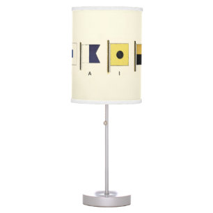 Painting of Four Flags with Sail Written Beneath Table Lamp