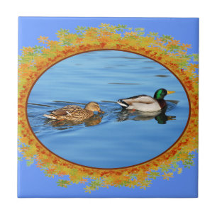 Pair of mallard ducks in frame of leaves tile