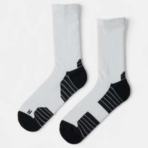 pair of white crew socks with black heel