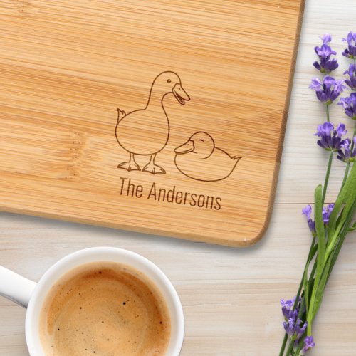 Pair of White Ducks Family Name Cutting Board