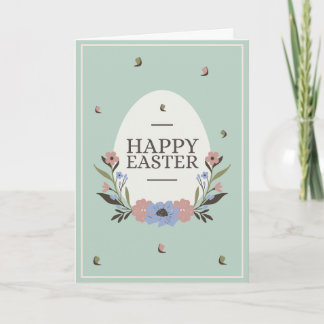 Pale green background with a white egg and flowers card