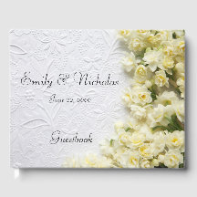 Pale narcissus flowers on texture