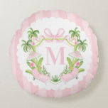 Palm Beach Pink Loungers Monogram Crest Round Pillow<br><div class="desc">This pillow has a preppy grandmillennial design featuring a pink and green Palm Beach crest with a pink pool chairs and umbrellas surrounded by palm trees. There is a scalloped border around the edge. You can personalize with your initial.</div>