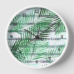 Palm leaves on a striped black and white backgroun clock