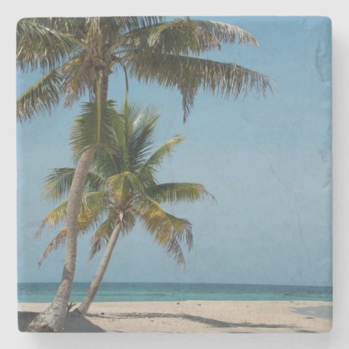 Palm tree and white sand beach stone coaster