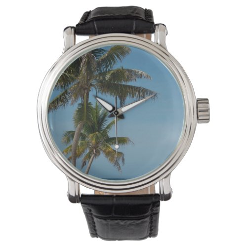 Palm tree and white sand beach watch