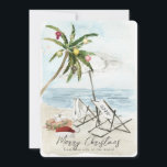 Palm Tree & Beach Chairs Tropical Holiday Card<br><div class="desc">This "Merry Christmas from this side of the world" Christmas holiday card features a palm tree with ornaments and lights, a pair of beach chairs under the umbrella on a sandy beach in watercolor. The reverse side features palm trees and ocean in watercolor. Personalize it for your needs. You can...</div>