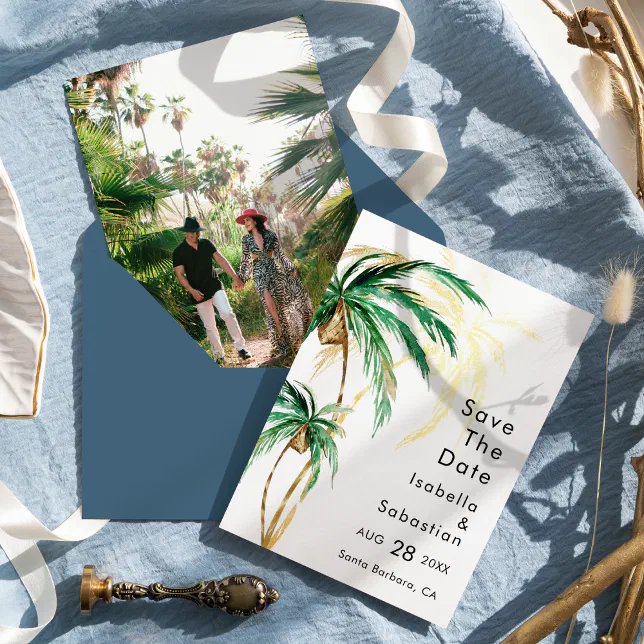 A tropical-themed Save the Date. Both the front and back of the card can be seen, along with a blue envelope and an ornament.