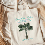 Palm Tree Wedding Welcome Guests Tote Bag<br><div class="desc">Single palm tree wedding welcome tote bag. Personalize with blue text to welcome guests to a tropical destination wedding event. "Welcome to our wedding" in script across the top, with names of the couple, location and date at the bottom beneath the tree. The design and wording is printed on one...</div>