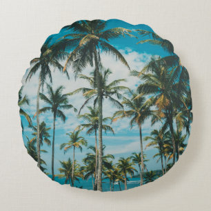 Palm trees above the ocean, vintage toned and retr round pillow