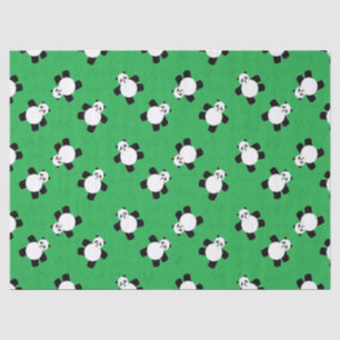 Panda bear laying on grass tissue paper