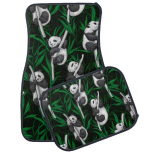 Panda cubs on dark green car floor mat