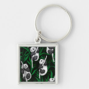 Panda cubs on dark green keychain