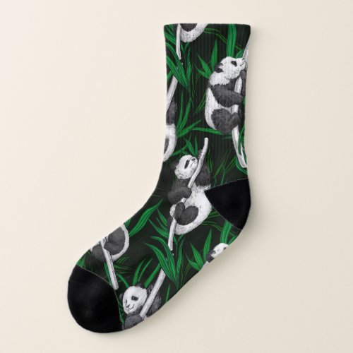 Panda cubs on dark green socks