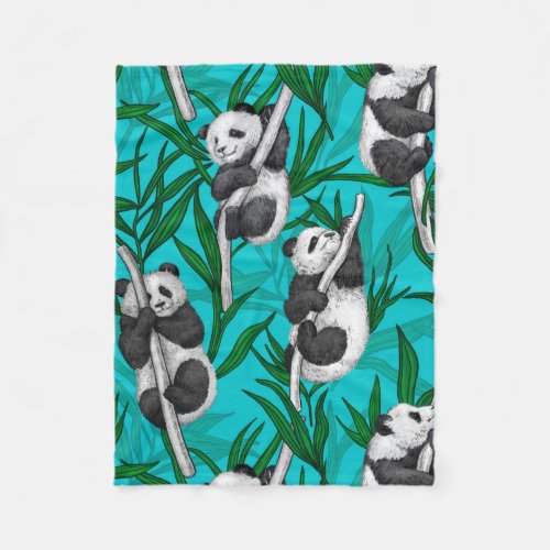 Panda cubs on turquoise fleece blanket