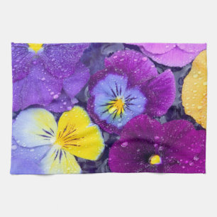 Pansy flowers floating in bird bath with dew 2 towel