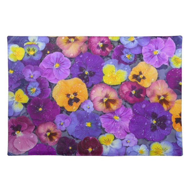 Pansy flowers floating in bird bath with dew cloth placemat (Front)