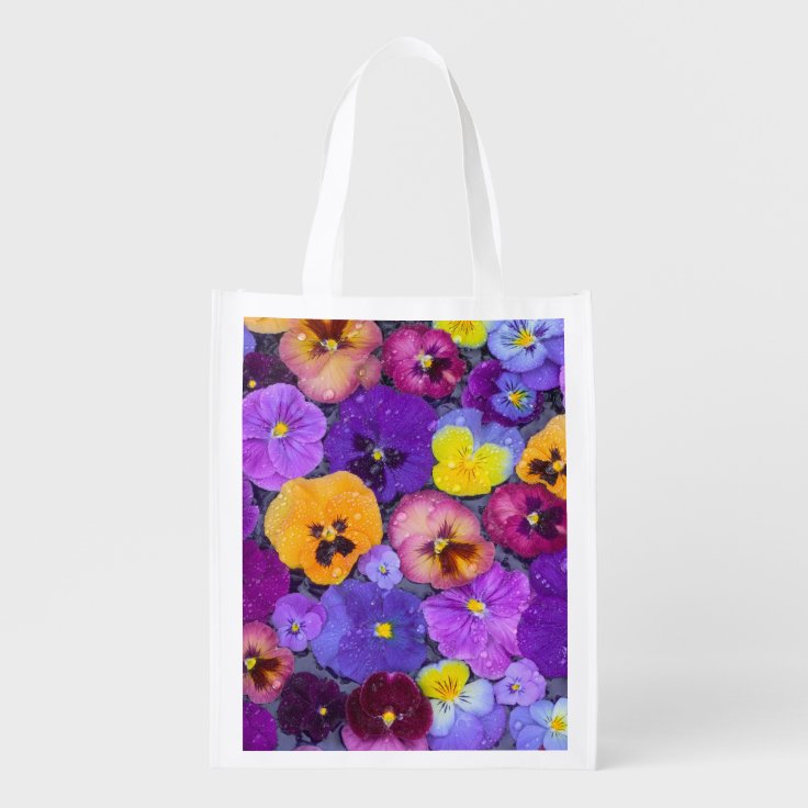 Pansy flowers floating in bird bath with dew grocery bag Zazzle