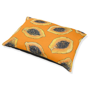 Papaya slices on orange pet bed