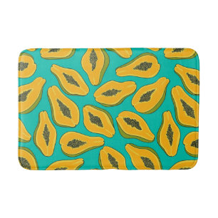 Papaya slices on turquoise bath mat