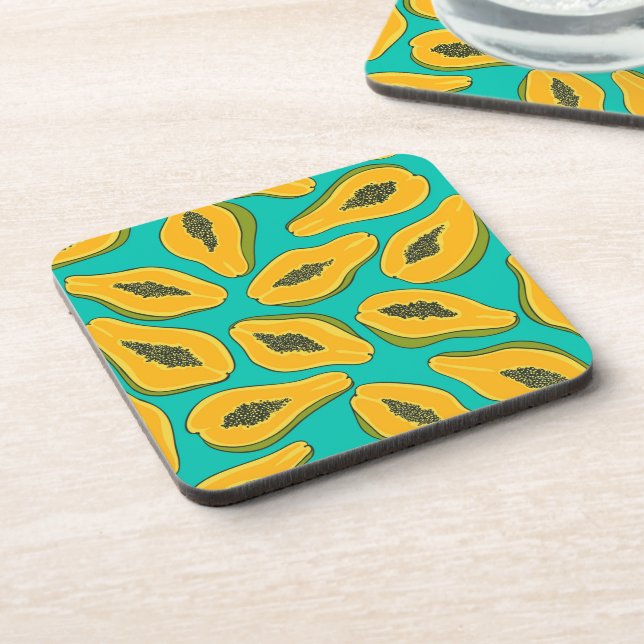 Papaya slices on turquoise beverage coaster (Left Side)