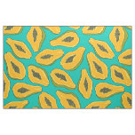 Papaya slices on turquoise fabric