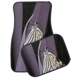 Paper kite butterfly on purple car floor mat