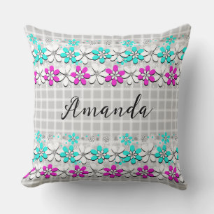 Paper neon flowers on a gray-white checkered throw pillow