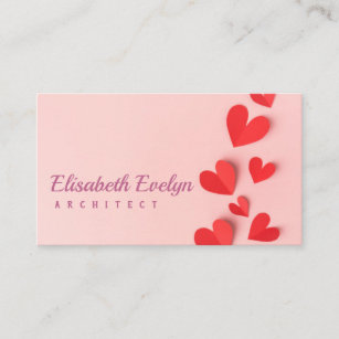 Paper valentines day hearts on pink business card