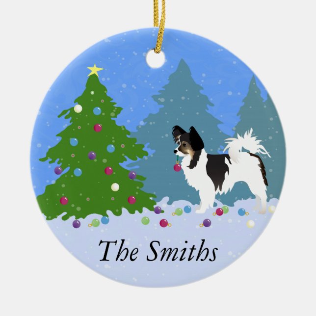 Papillon Dog Decorating Christmas Tree in Forest Ceramic Ornament (Front)