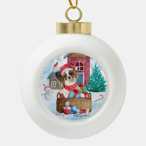 Papillon Dog In snow Christmas Dog House Ceramic Ball Christmas Ornament