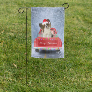Papillon Dog in Snow sitting in Christmas Truck Garden Flag